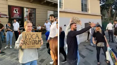 Genç kadın 'Koca Arıyorum' dövizi ile olay yarattı