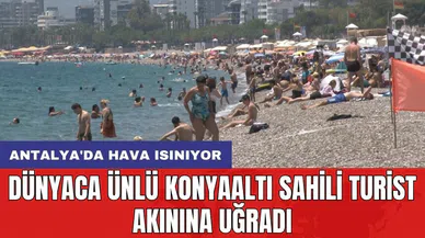 Antalya'da hava ısınıyor: Dünyaca ünlü Konyaaltı Sahili turist akınına uğradı
