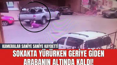 Sokakta yürürken geriye giden arabanın altında kaldı! Kameralar saniye saniye kaydetti