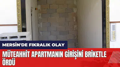 Mersin'de fıkralık olay! Apartmanın girişini briketle ördü