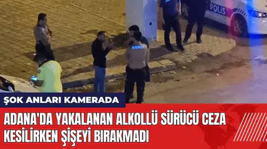 Adana'da yakalanan alkollü sürücü ceza kesilirken şişeyi bırakmadı