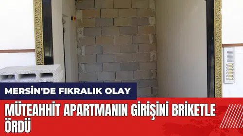 Mersin'de fıkralık olay! Apartmanın girişini briketle ördü